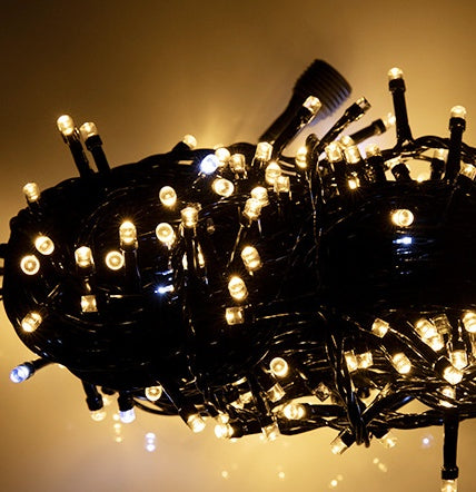 black fairy string light warm singapore christmas tree